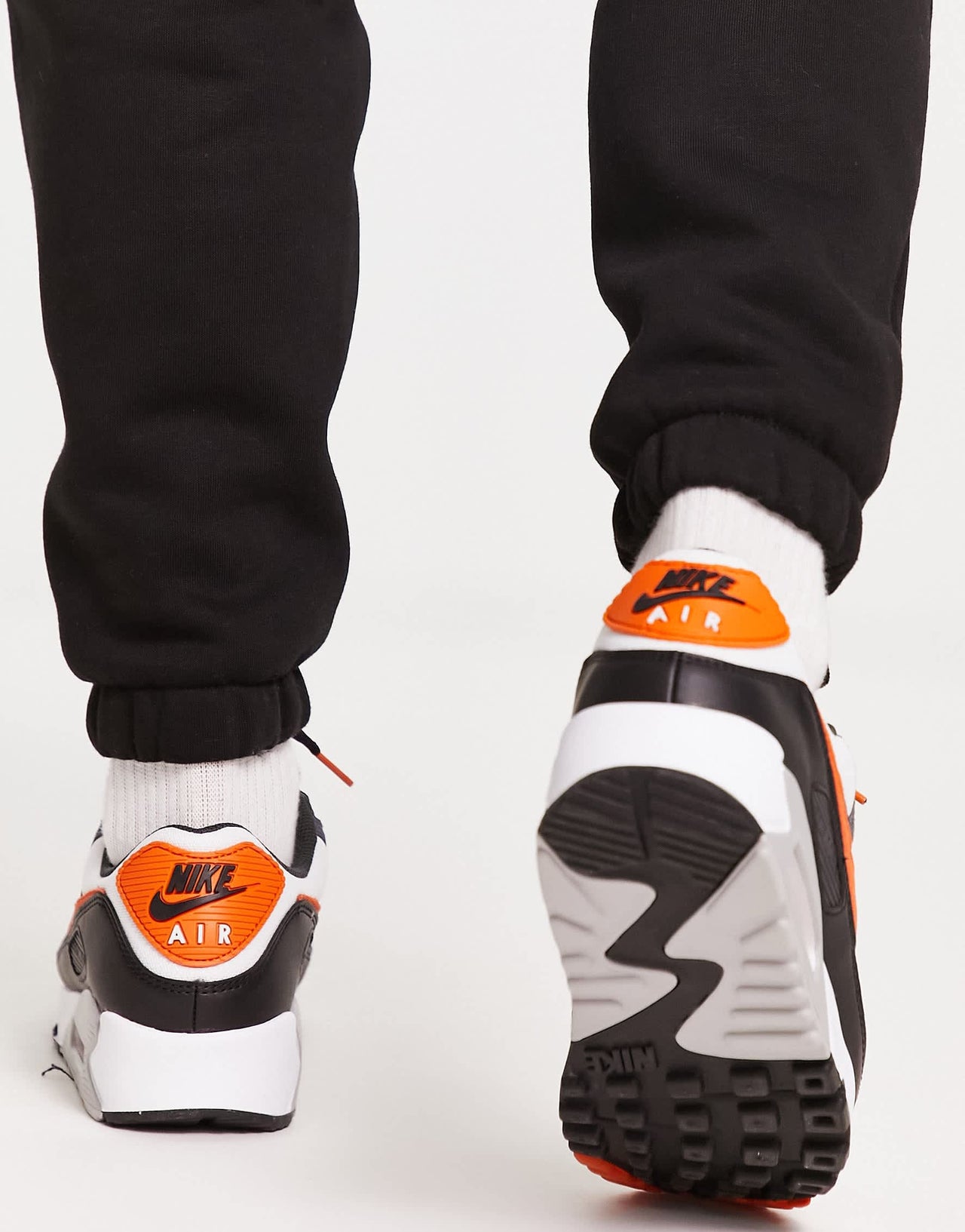 Nike air max 90 trainers in black and orange