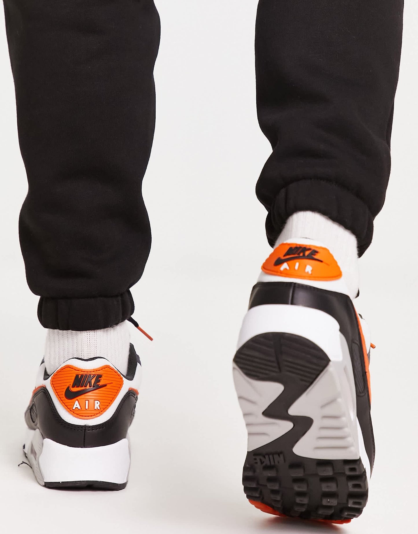 Nike air max 90 trainers in black and orange