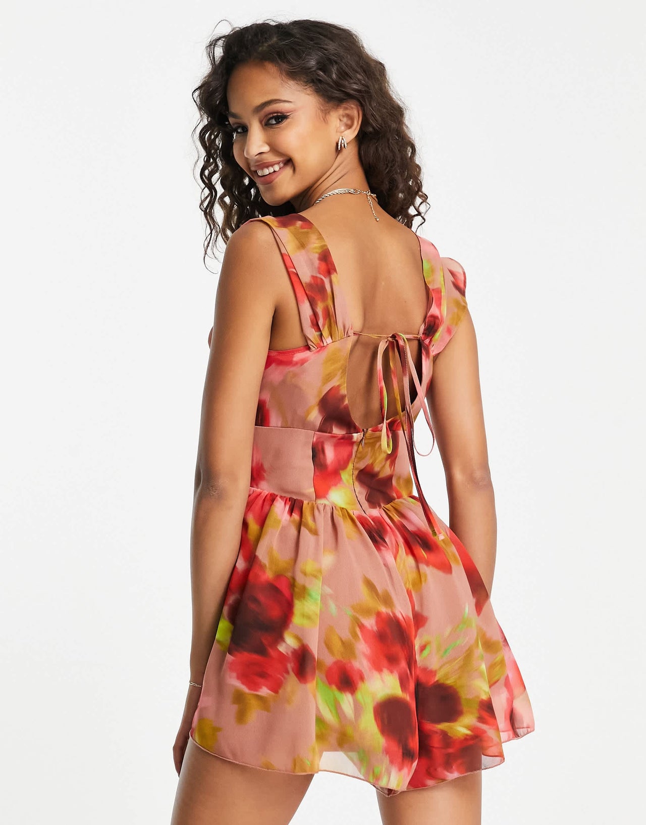 ASOS DESIGN corset detail cowl neck playsuit in blurred floral print