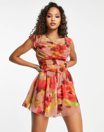 ASOS DESIGN corset detail cowl neck playsuit in blurred floral print