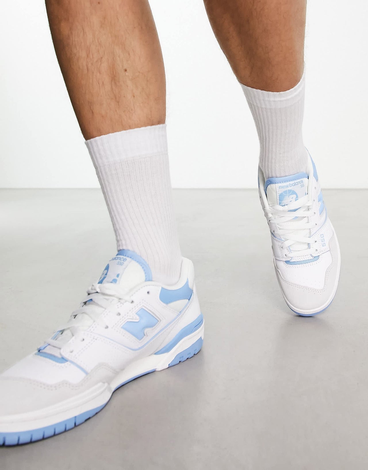 New Balance 550 trainers in white and blue