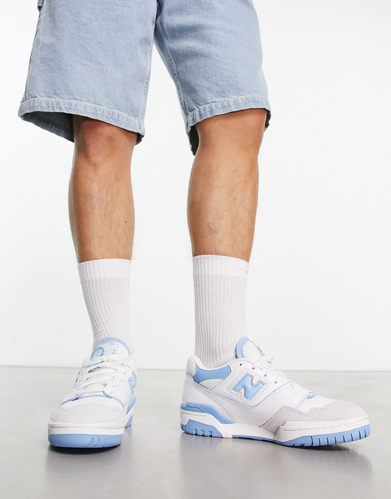 New Balance 550 trainers in white and blue