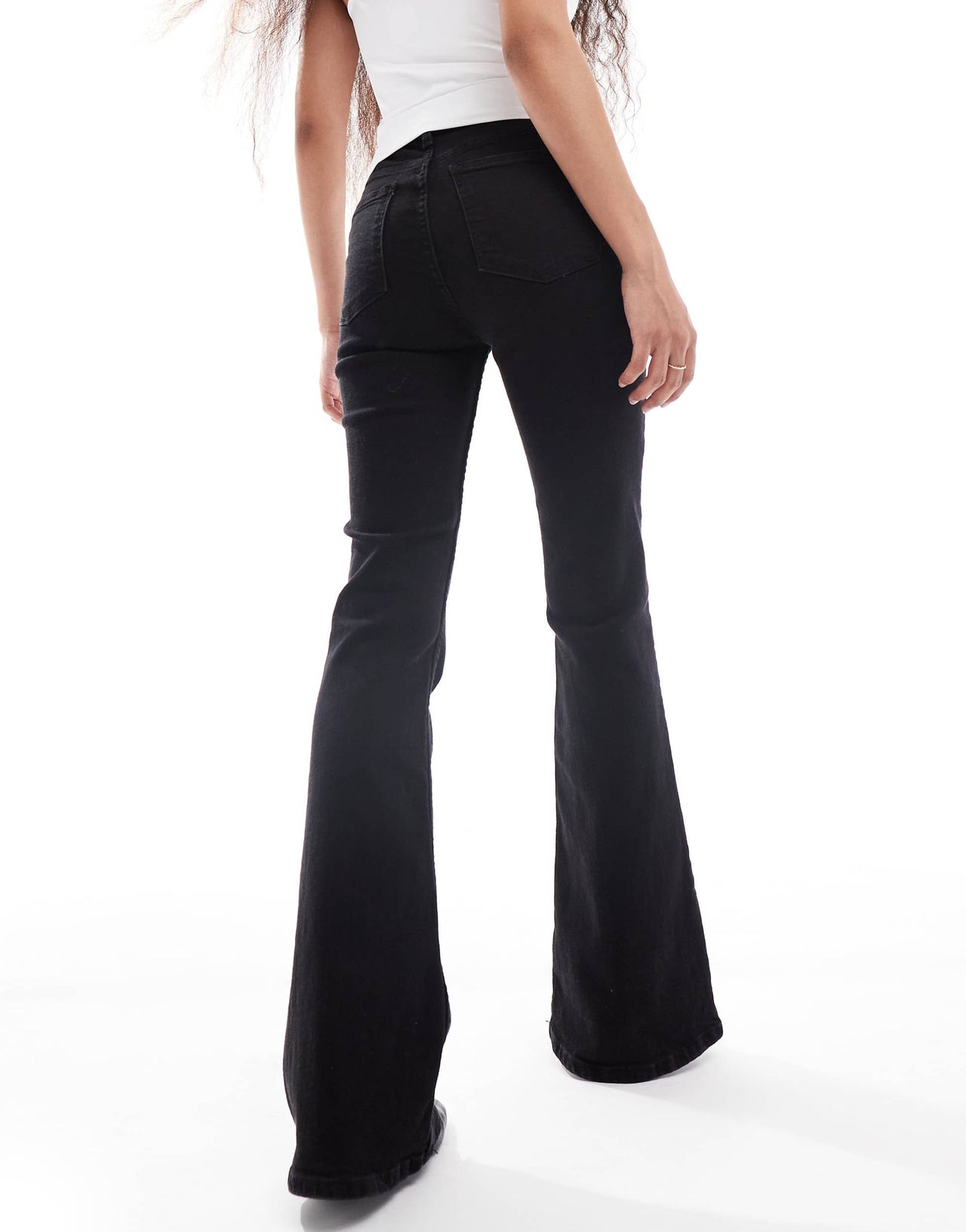 Bershka Petite bootcut flared jeans in black