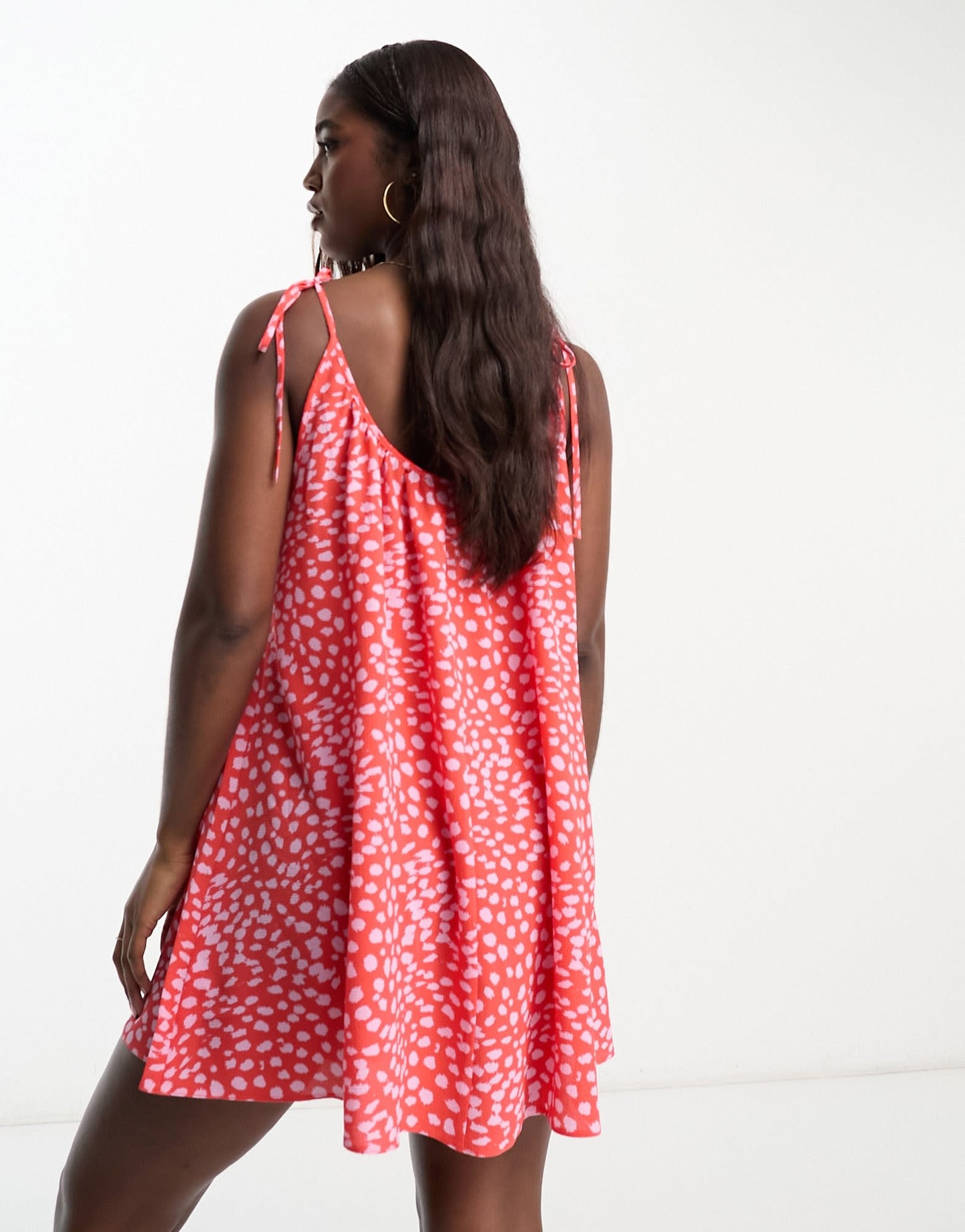 ASOS DESIGN tie strap detail trapeze mini slip dress in red and pink animal spot print