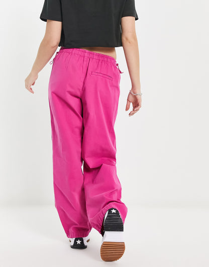 Bershka baggy parachute tech pant in pink