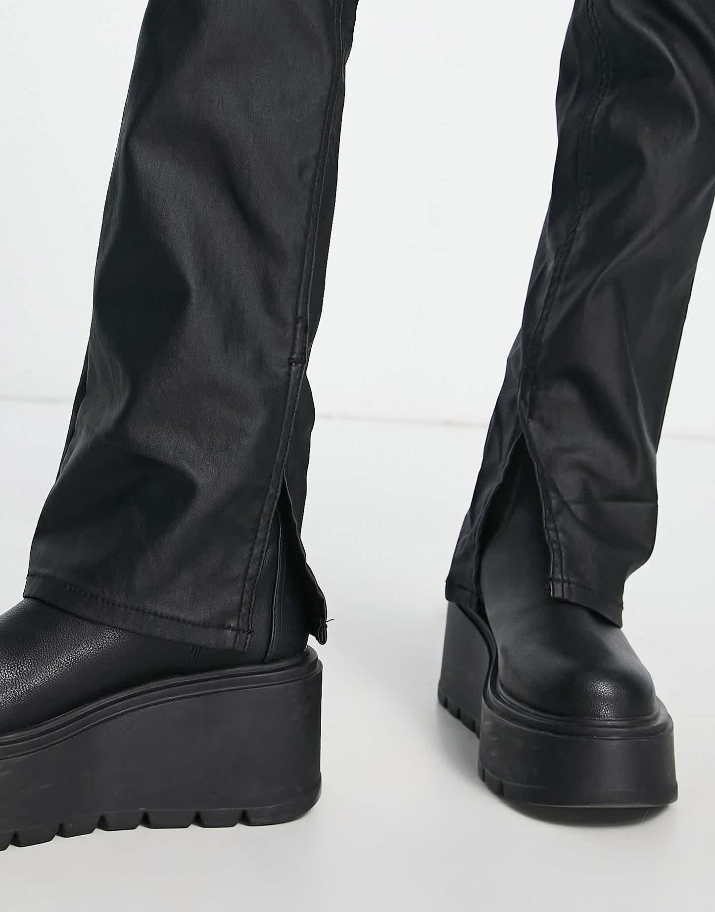 Stradivarius Petite coated flare jean with split hem detail in black
