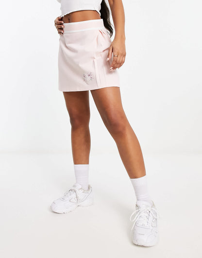 adidas Originals pleated skirt in pastel pink with floral logo
