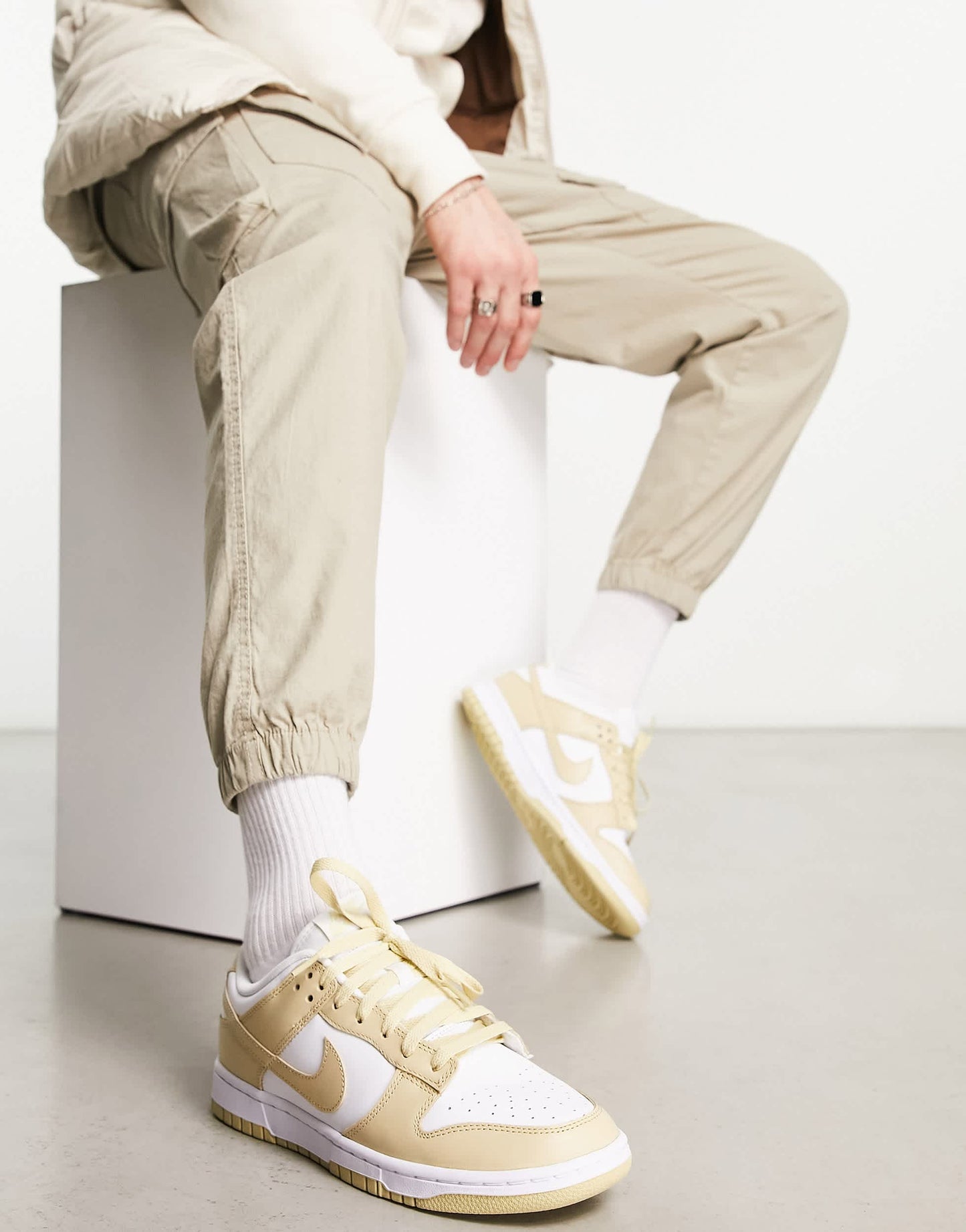 Nike Dunk Low trainers in white and gold