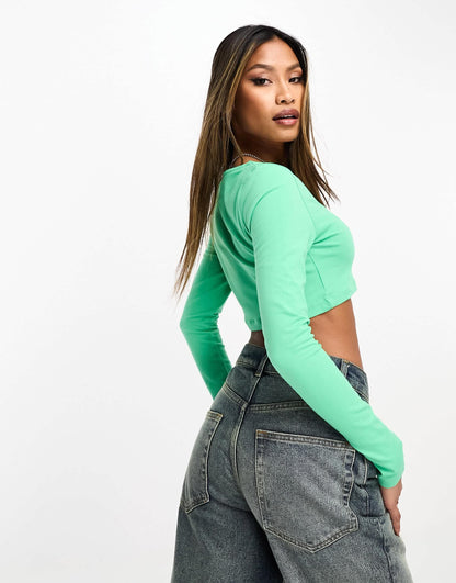 Nike Dance mini swoosh long sleeve crop top in spring green