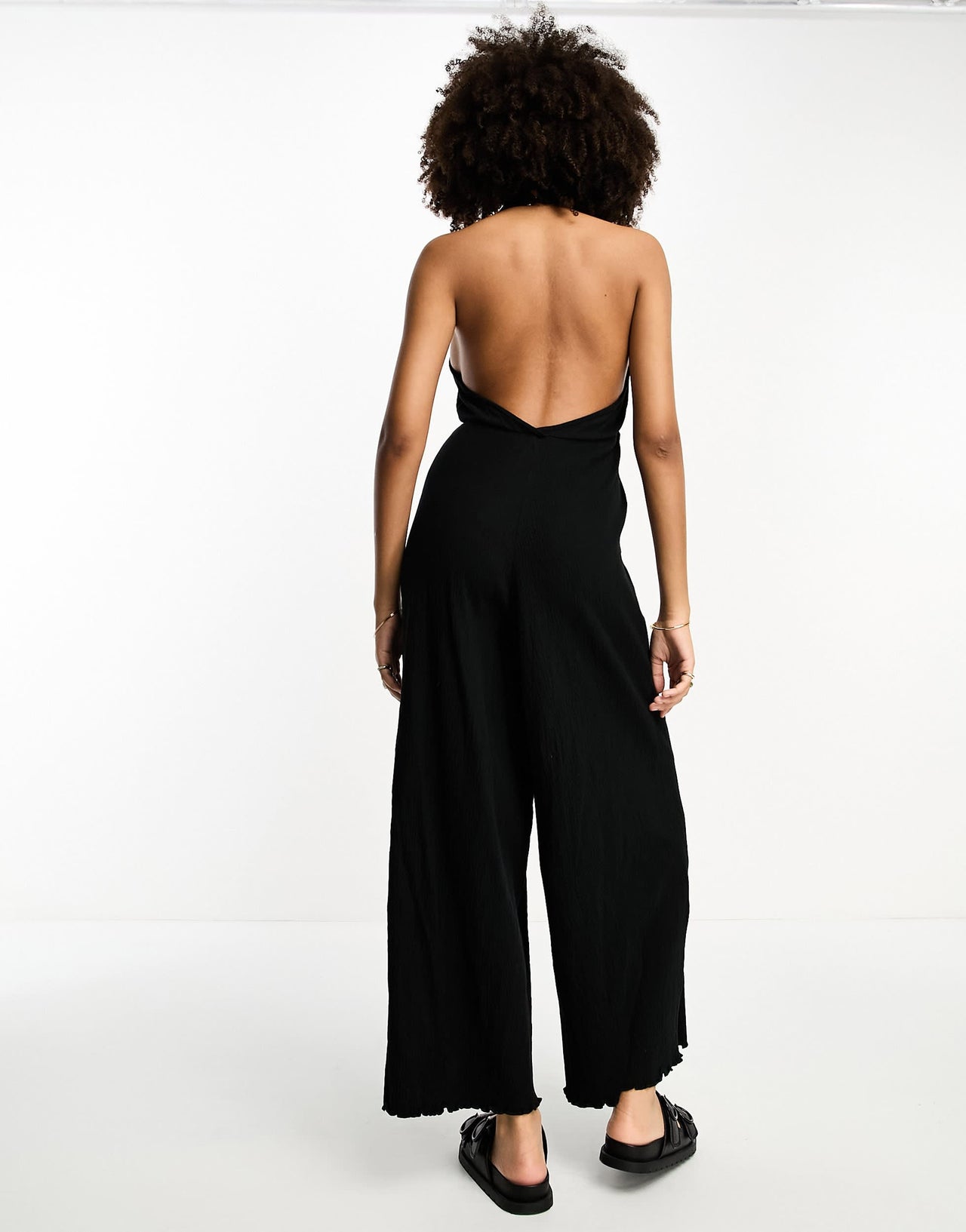 ASOS DESIGN crinkle jersey halter jumpsuit in black