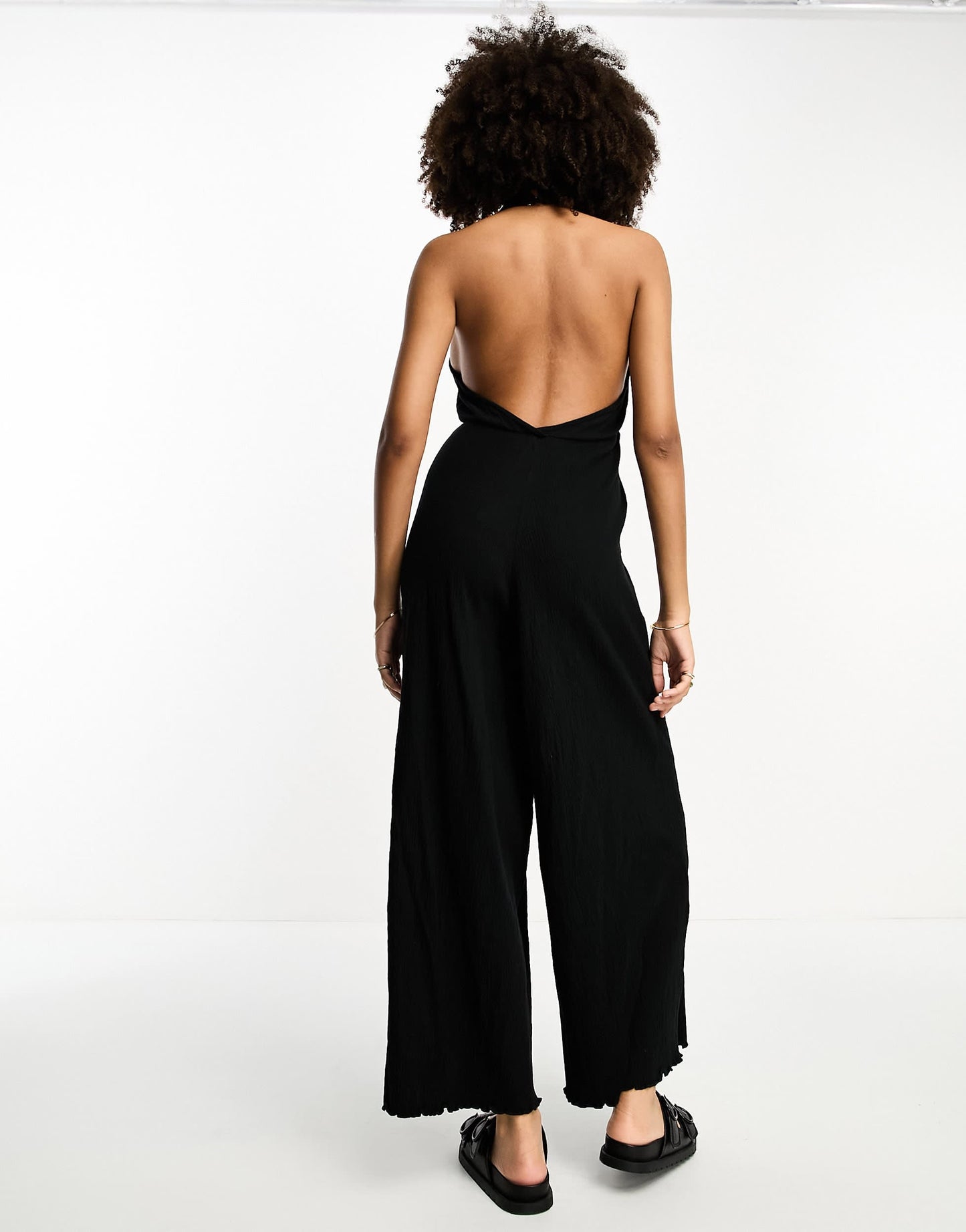 ASOS DESIGN crinkle jersey halter jumpsuit in black
