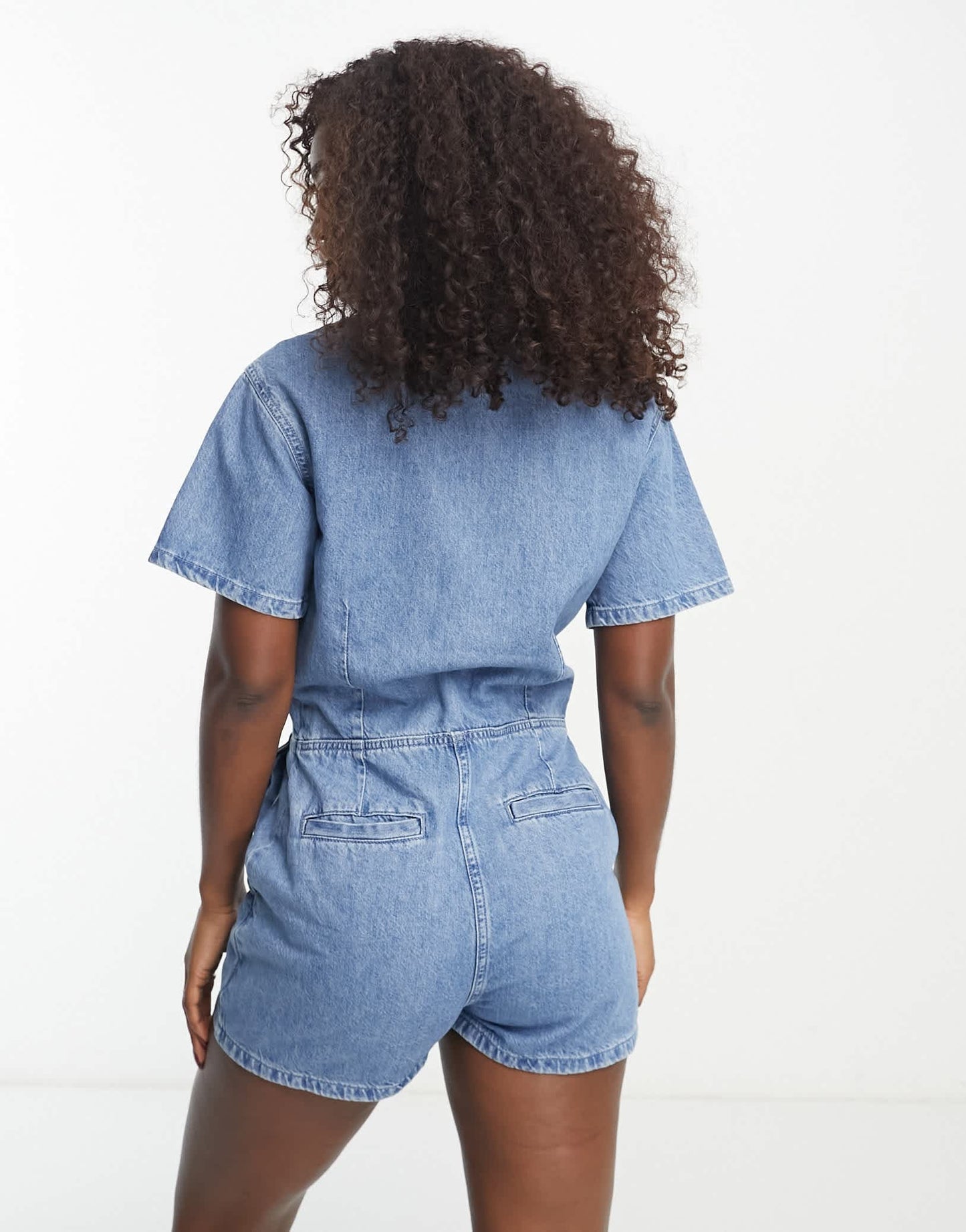 Tommy Jeans logo badge denim playsuit in mid wash