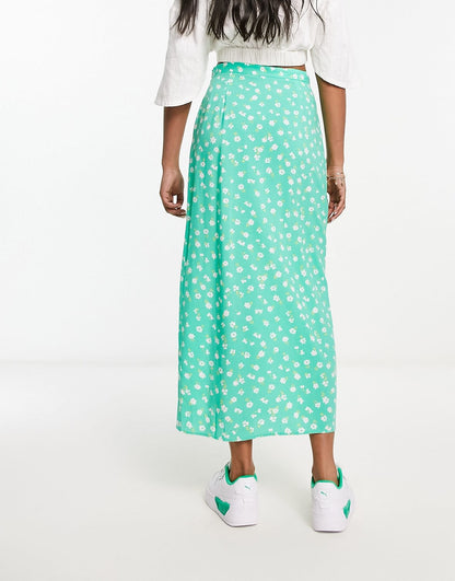 ASOS DESIGN bow detail midi skirt with thigh split in green ditsy floral