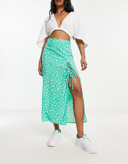 ASOS DESIGN bow detail midi skirt with thigh split in green ditsy floral