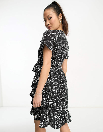 Vero Moda Petite wrap mini dress in black spot print