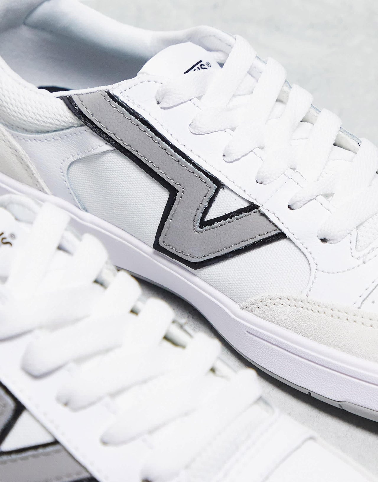 Vans Lowland trainers in white with grey side stripe