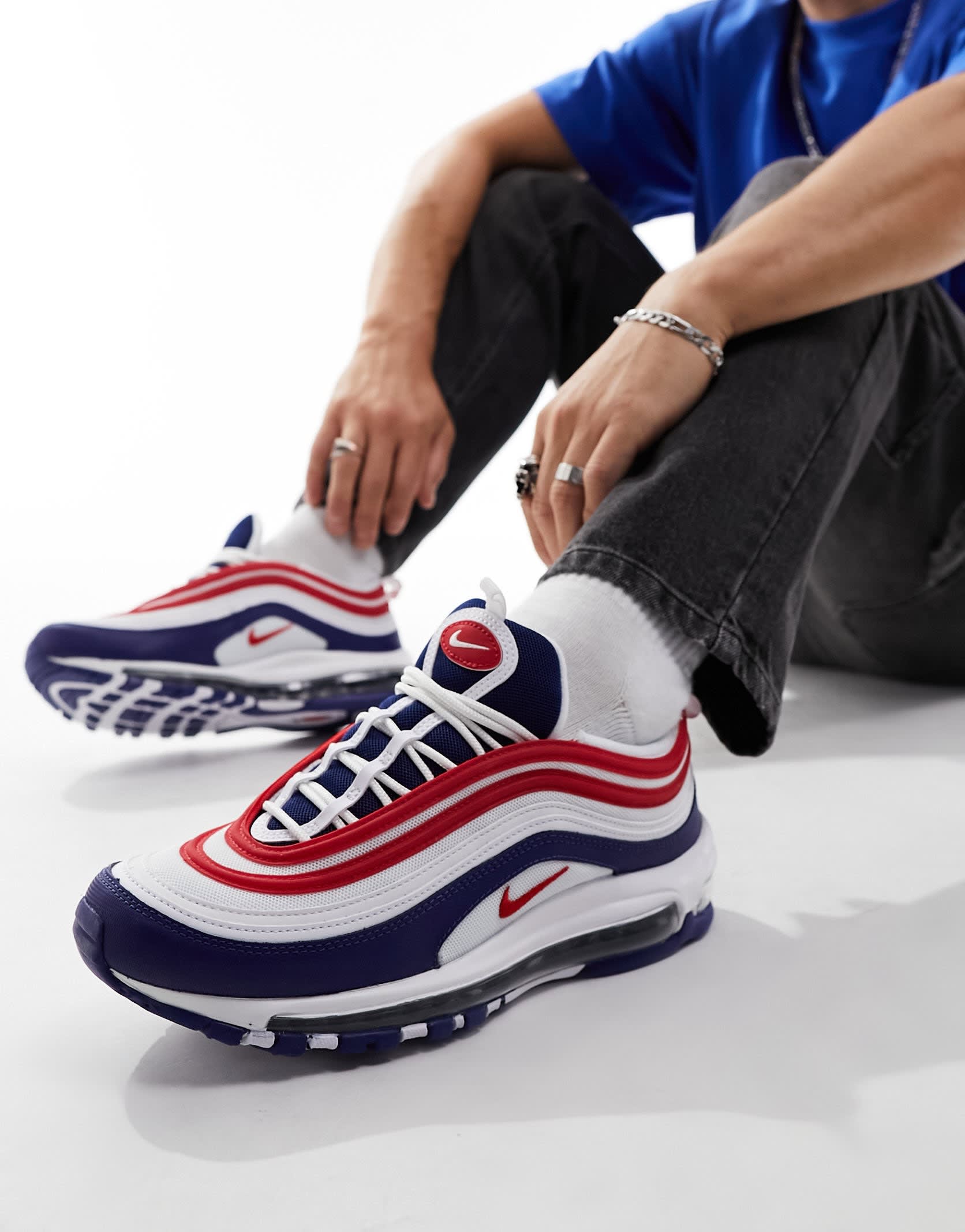 Nike Air Max 97 trainers in blue and red