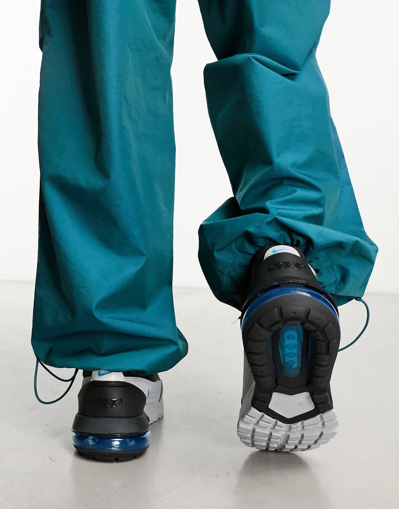 Nike Air Max Pulse trainers in black and grey