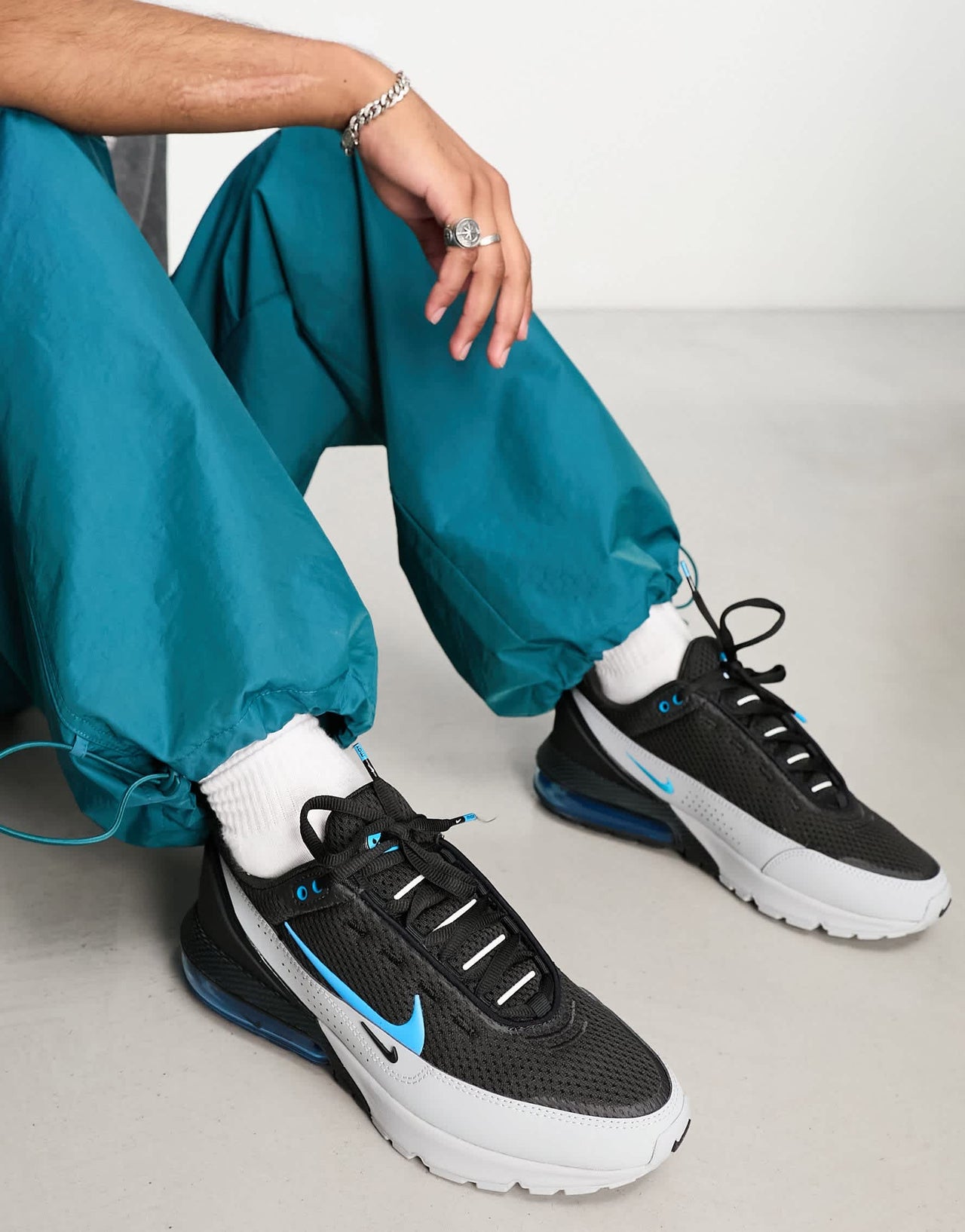 Nike Air Max Pulse trainers in black and grey