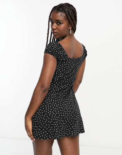 ASOS DESIGN cap sleeve ruched mini dress with tie detail in spot