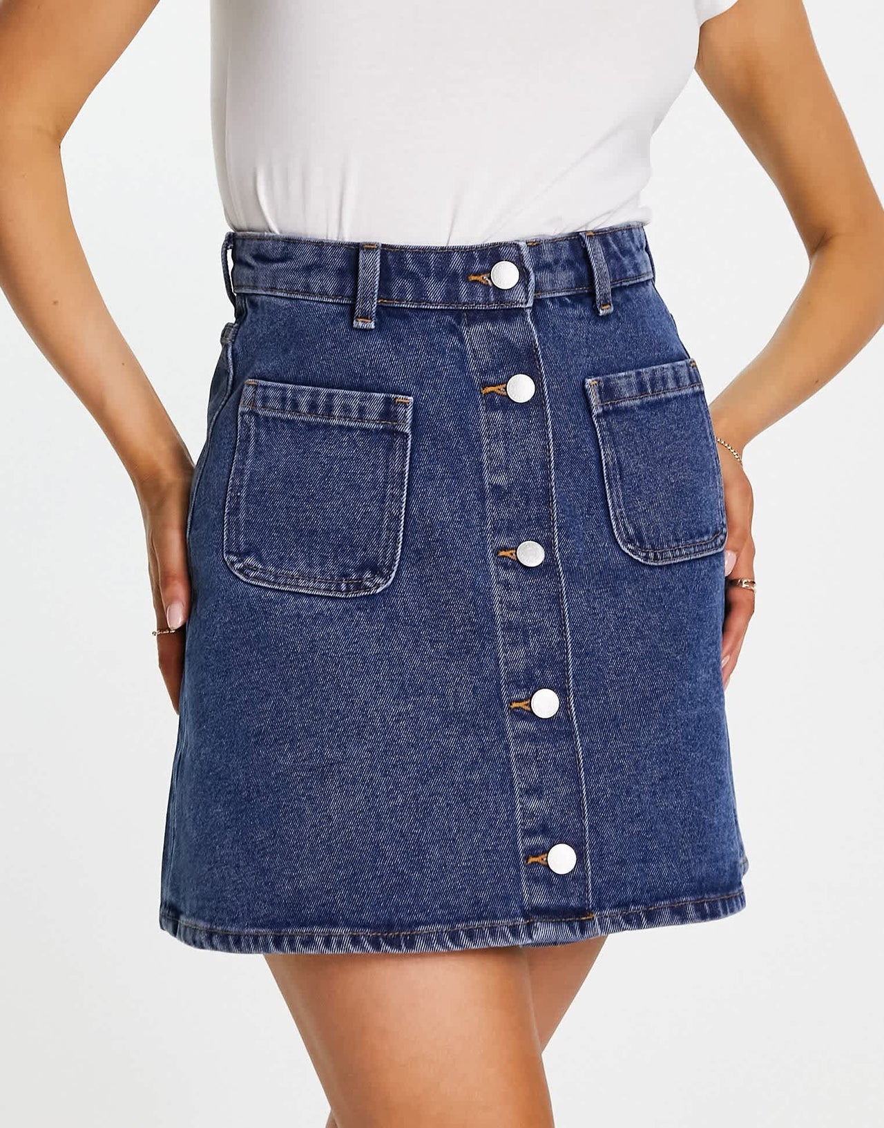 Monki denim button through mini skirt in mid blue wash