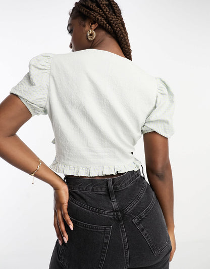 The Frolic exclusive v-neck button front puff sleeve blouse in blue gingham