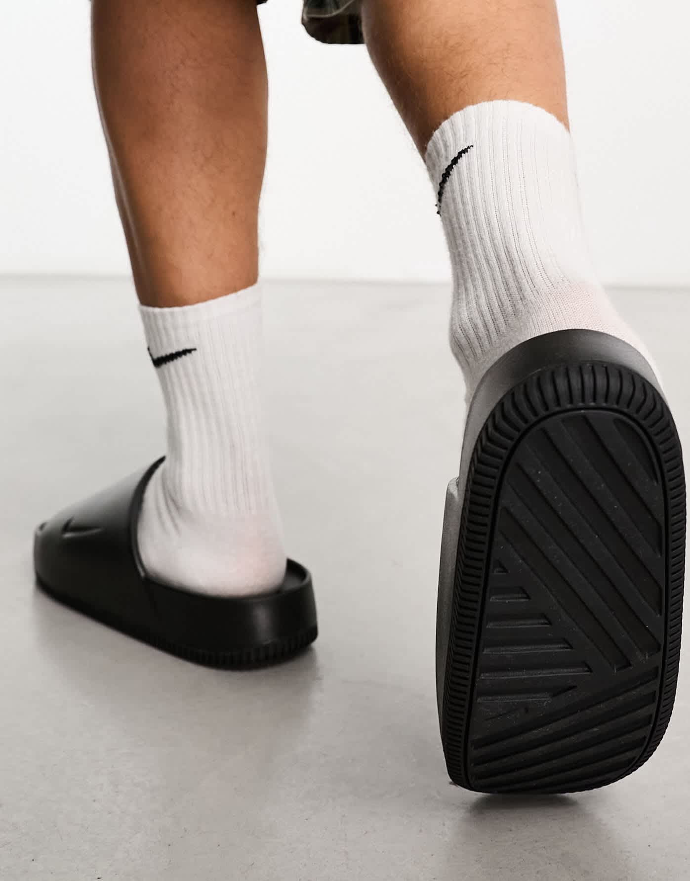 Nike Calm sliders in black