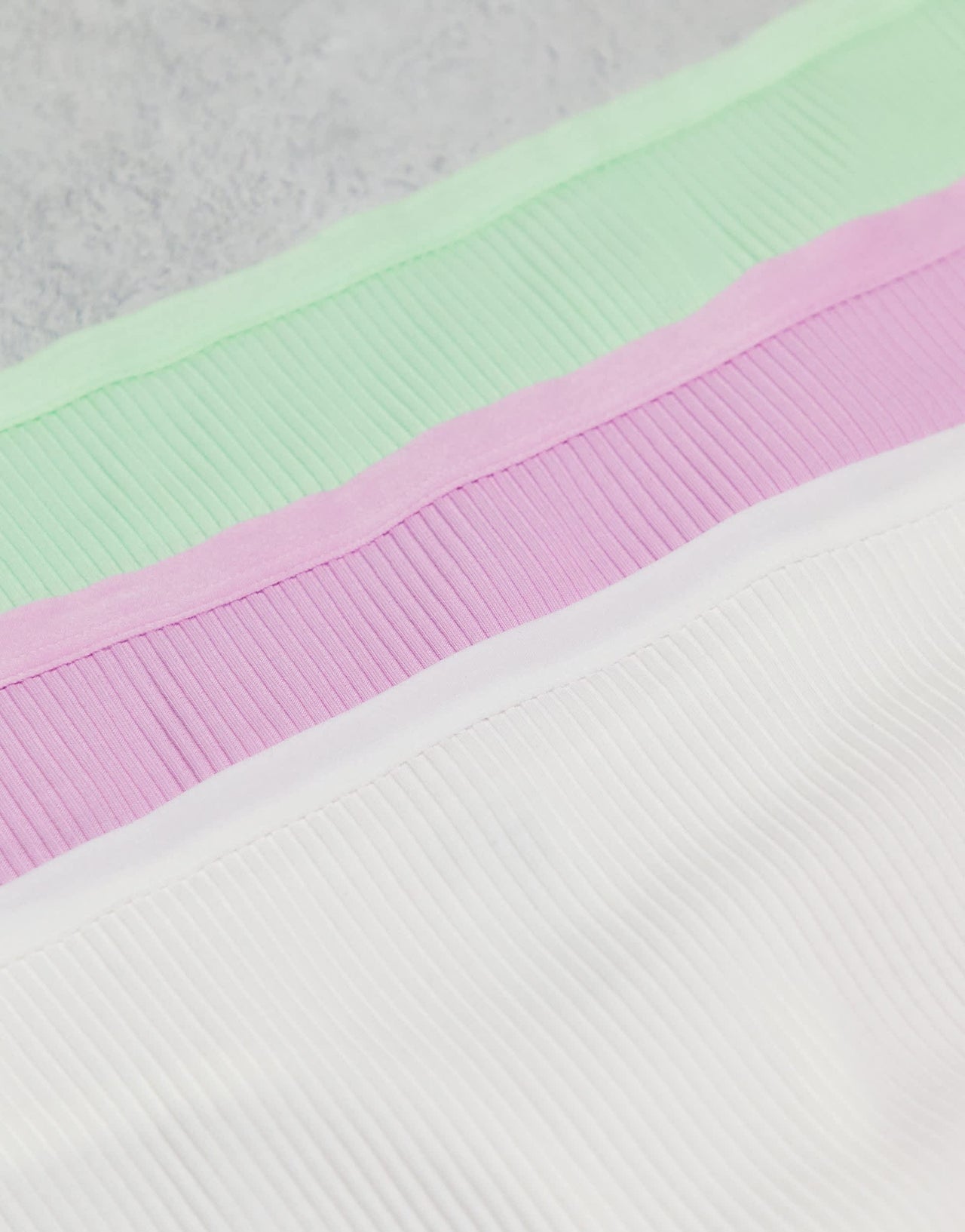 ASOS DESIGN Curve 3 pack ribbed thongs in white, lilac & pistachio