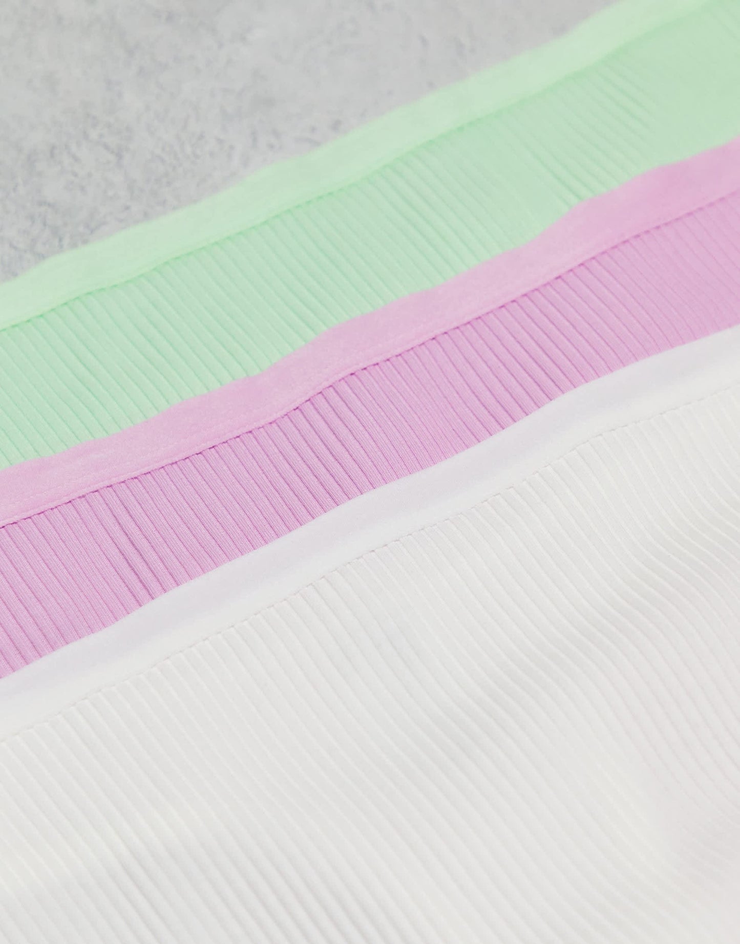 ASOS DESIGN Curve 3 pack ribbed thongs in white, lilac & pistachio