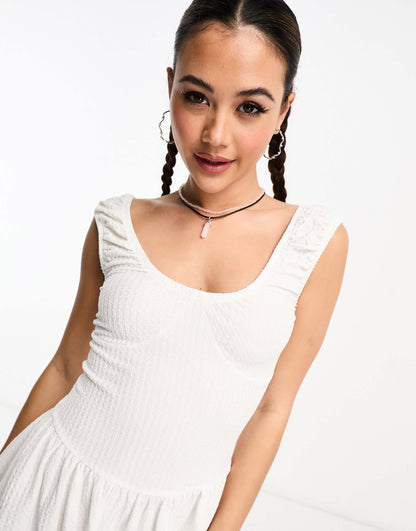 COLLUSION textured seamed mini sundress in white