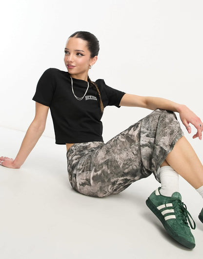 Dickies aitkin left chest varsity logo crop baby t-shirt in black exclusive to asos
