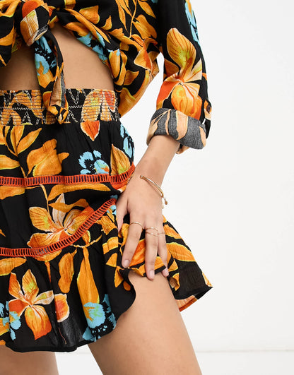 River Island shirred mini beach skirt co-ord in black tropical print