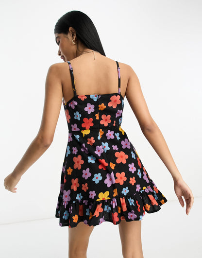 ASOS DESIGN linen cami mini sundress with ruffle hem in bold daisy print