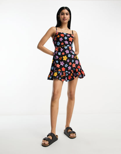 ASOS DESIGN linen cami mini sundress with ruffle hem in bold daisy print