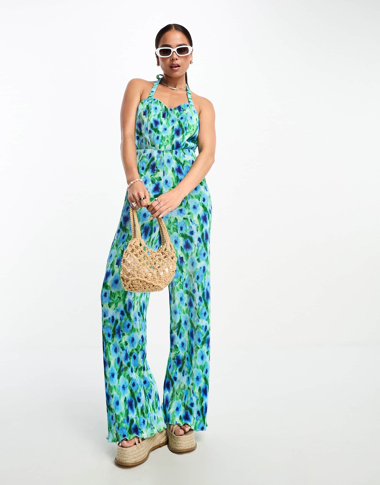 Monki jersey plisse cross back detail jumpsuit in blue and green flower print
