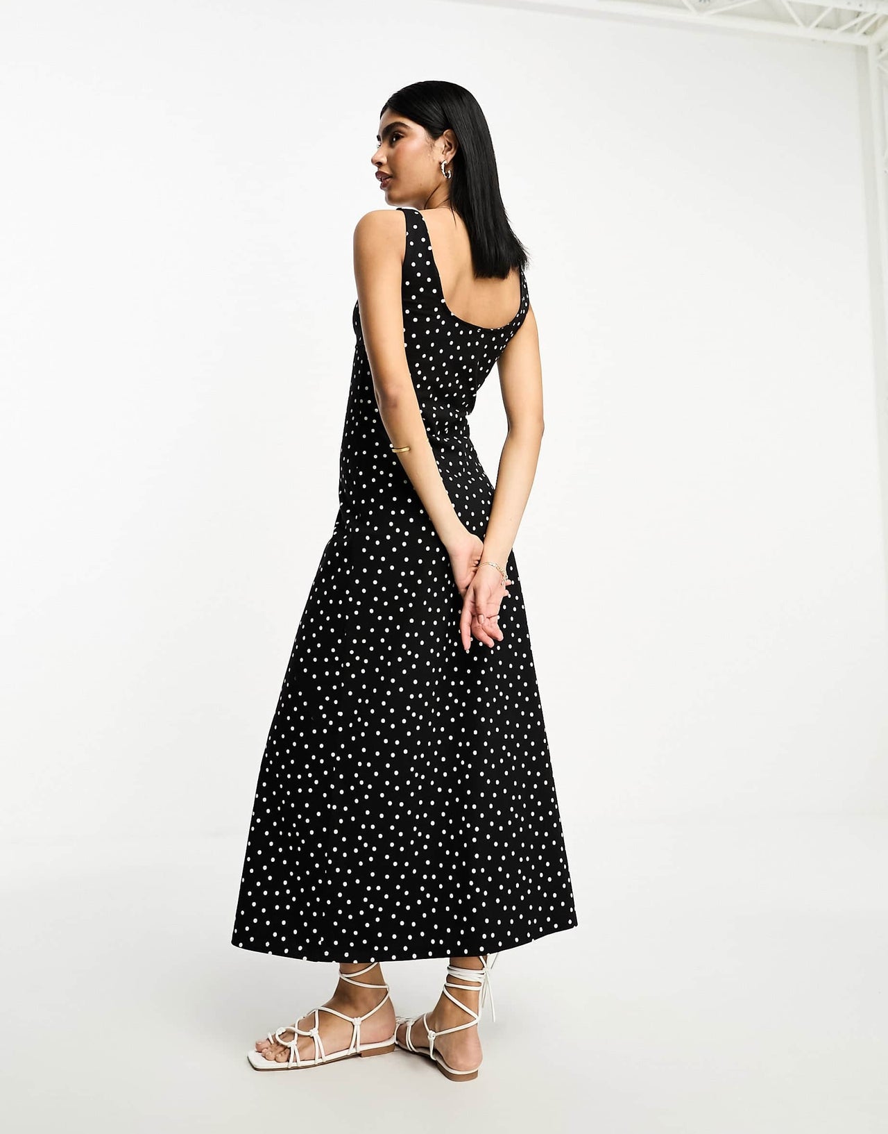 ASOS DESIGN sleeveless midi dress with buttons and tie detail in black spot