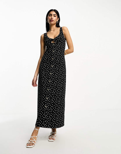 ASOS DESIGN sleeveless midi dress with buttons and tie detail in black spot