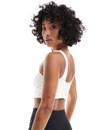 Nike Training swoosh corset light support sports bra in white - WHITE