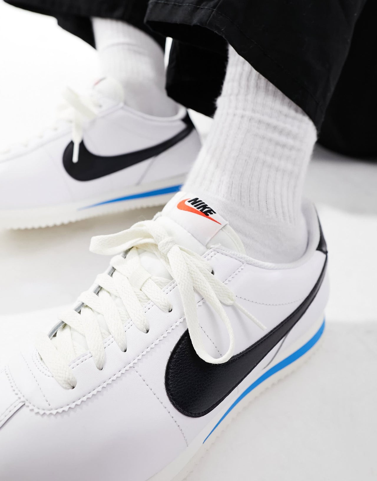 Nike Cortez leather trainers in white and black