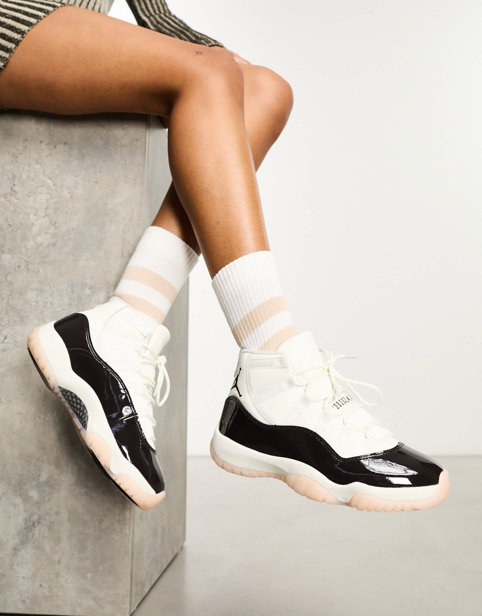 Nike Air Jordan 11 Retro trainers in off white and brown