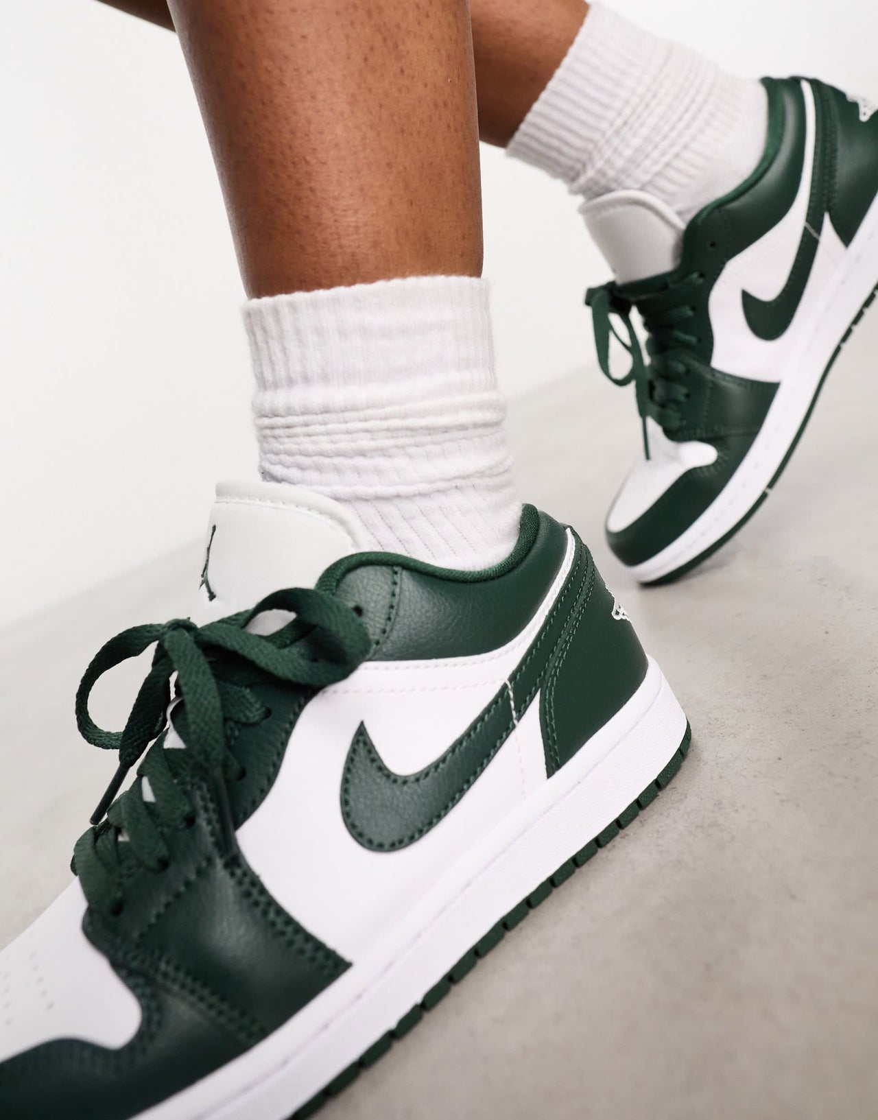 Nike Air Jordan 1 low trainers in white and jade green