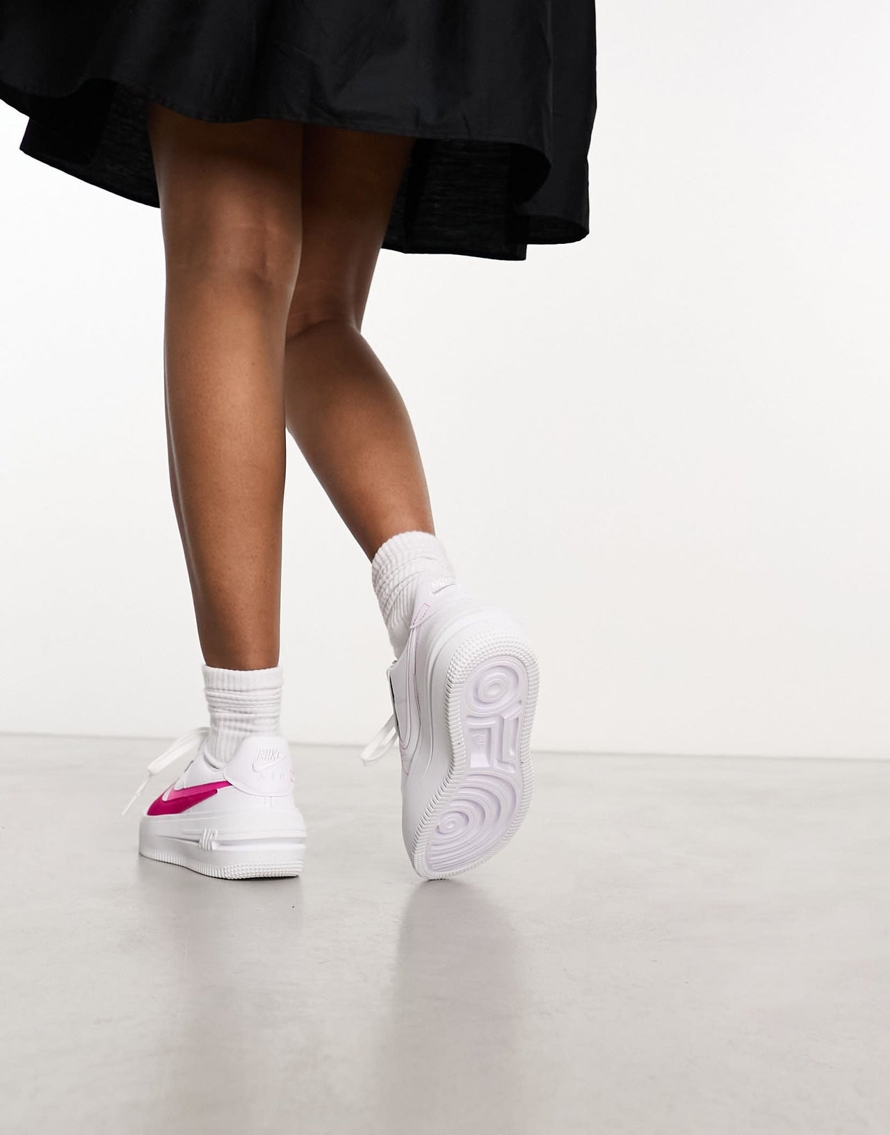 Nike Air Force 1 PLT.AF.ORM trainers in white and fierce pink