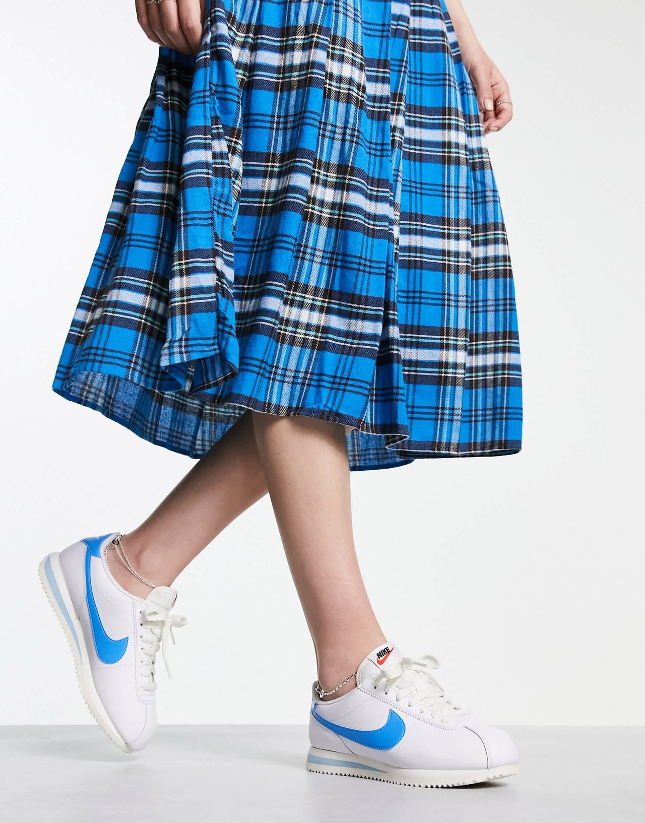 Nike Cortez leather trainers in off white and university blue