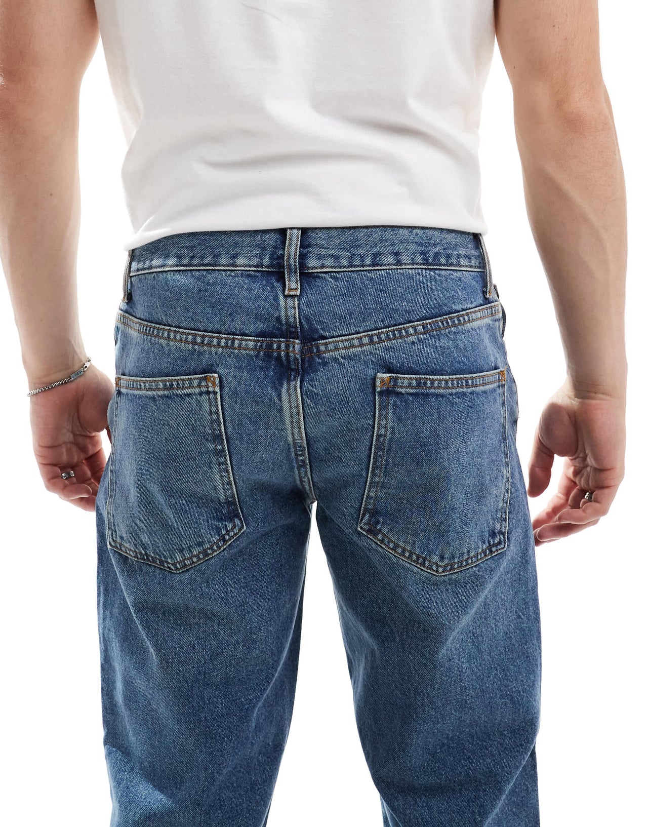 ASOS DESIGN tapered fit jeans in tinted dark wash blue