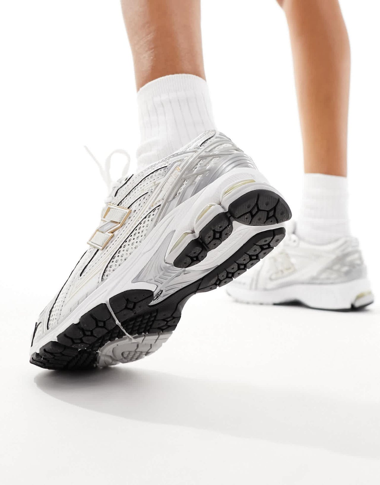 New Balance 1906 trainers in silver and gold