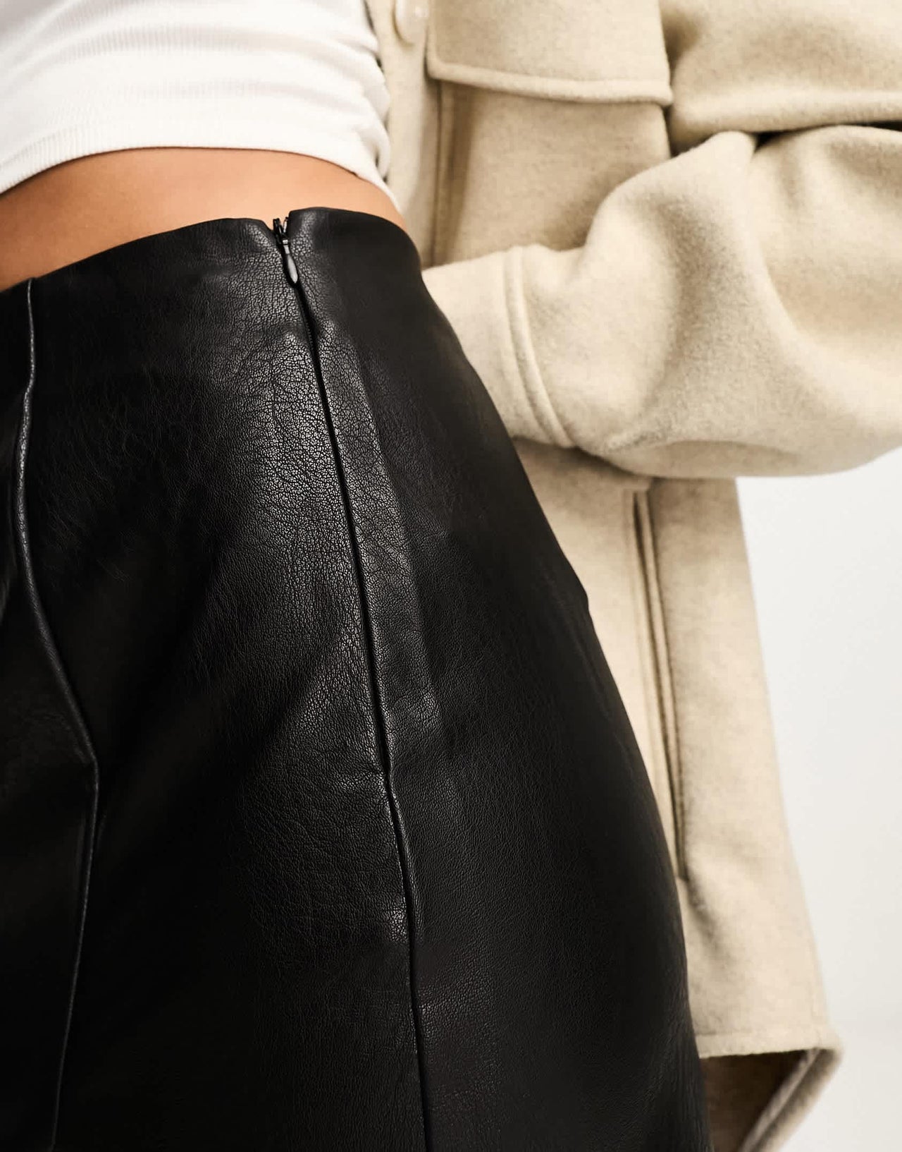 Stradivarius faux leather mini skirt with split hem in black