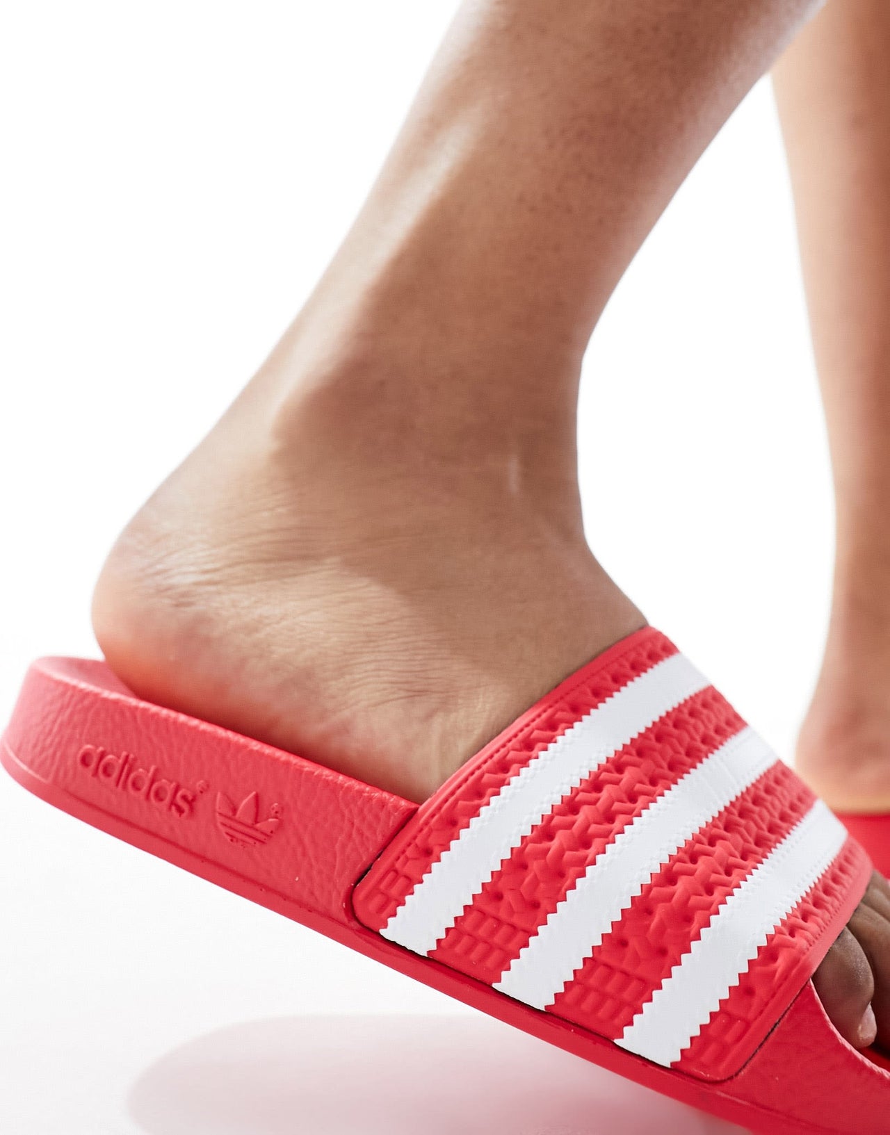 adidas Originals Adilette sliders in coral red