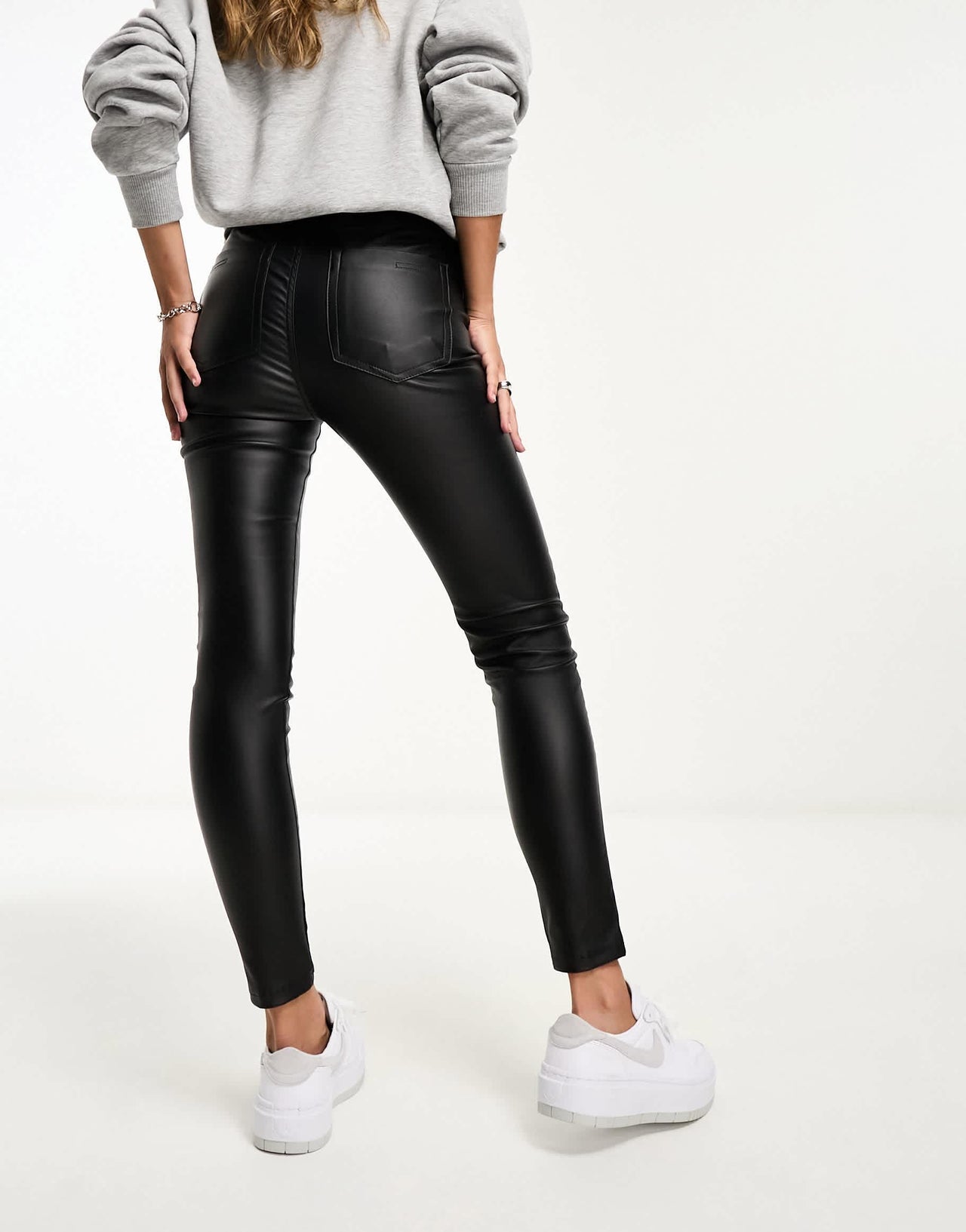 Bershka coated faux leather high waisted skinny trousers in black