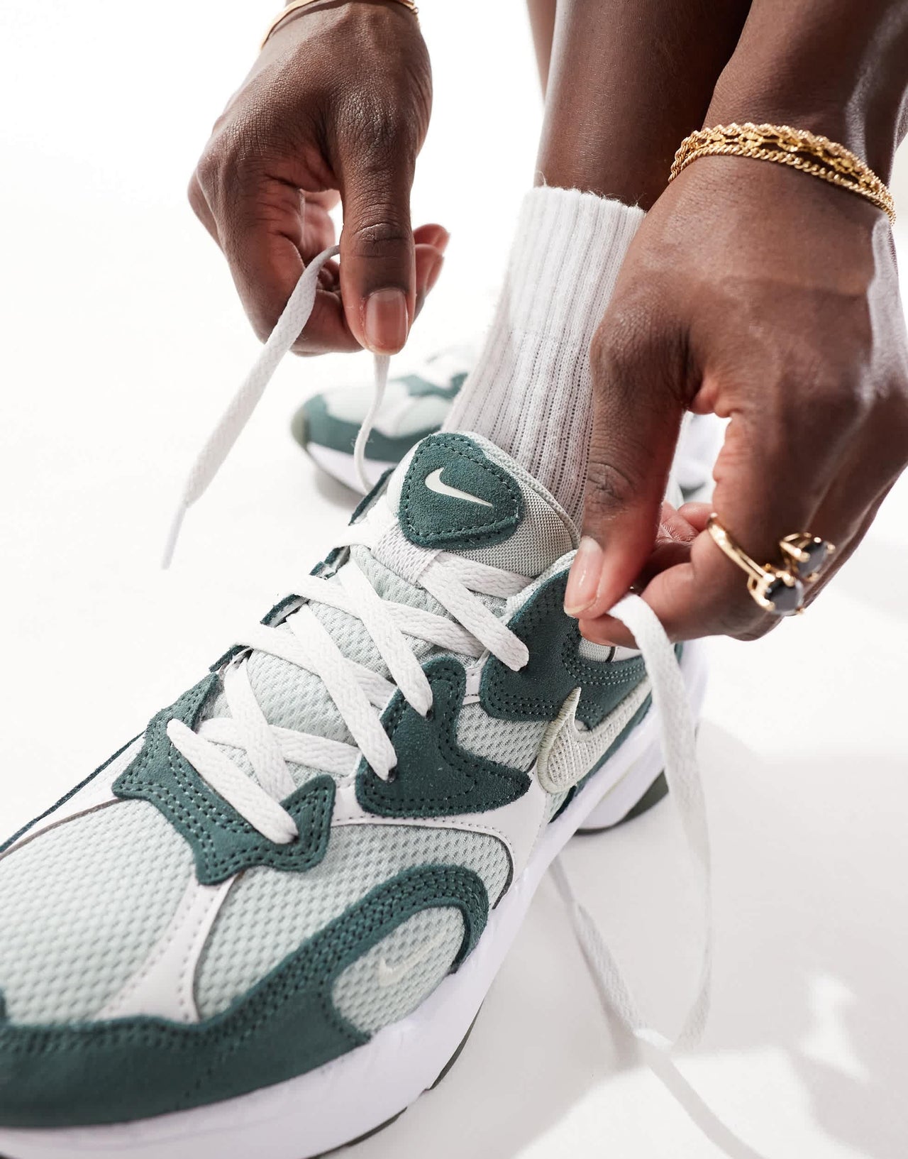 Nike AL8 trainers in green and white