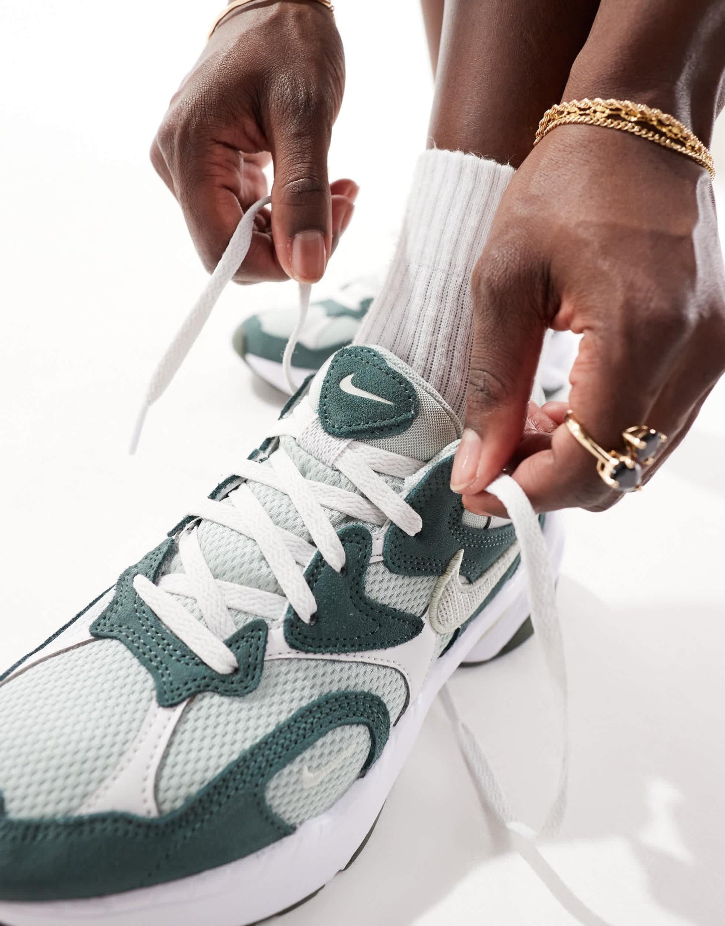 Nike AL8 trainers in green and white